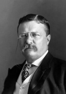 Black and white photo of President Roosevelt. Photograph showing head and shoulders, facing slightly left. 